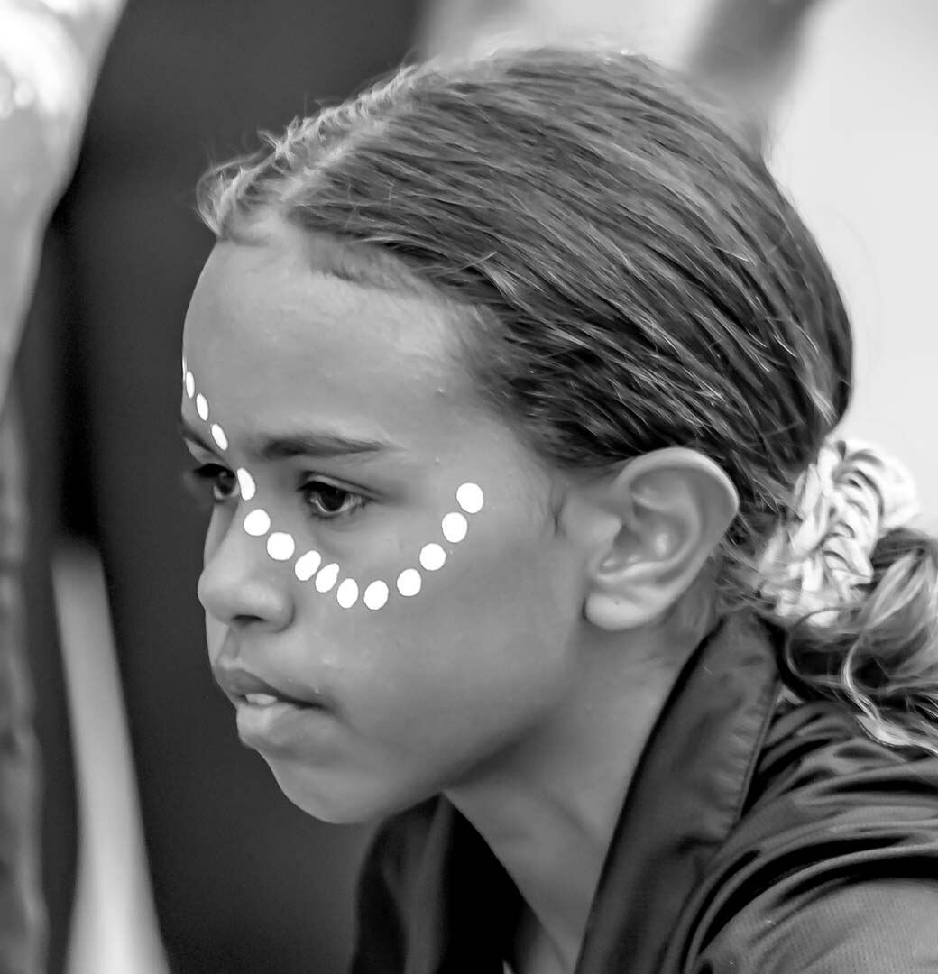 Young Dusty Feet Mob dancer with painted face markings