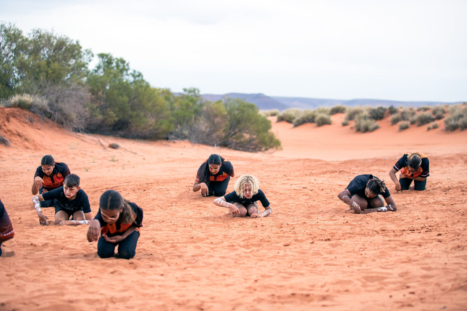 Dusty Feet Mob dancing on the sand hills of Port Augusta